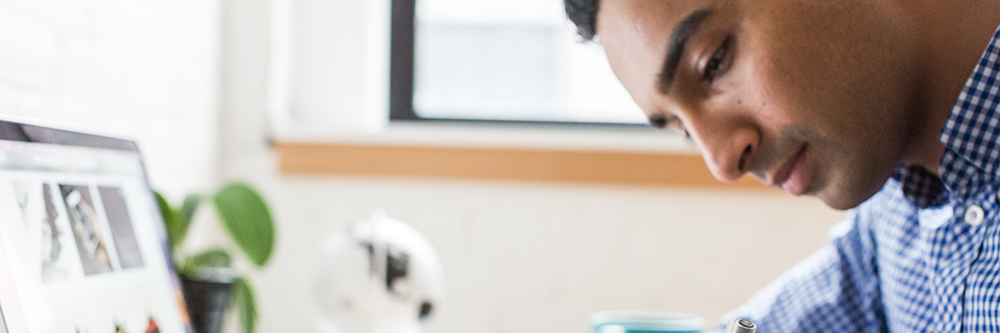 A man using a laptop.