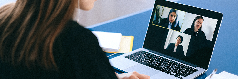 A woman using a laptop.